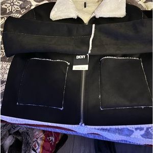 Women’s black and off white reversible faux fur zip up jacket with pockets